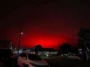 Red sky during traffic jam after thunderstorm